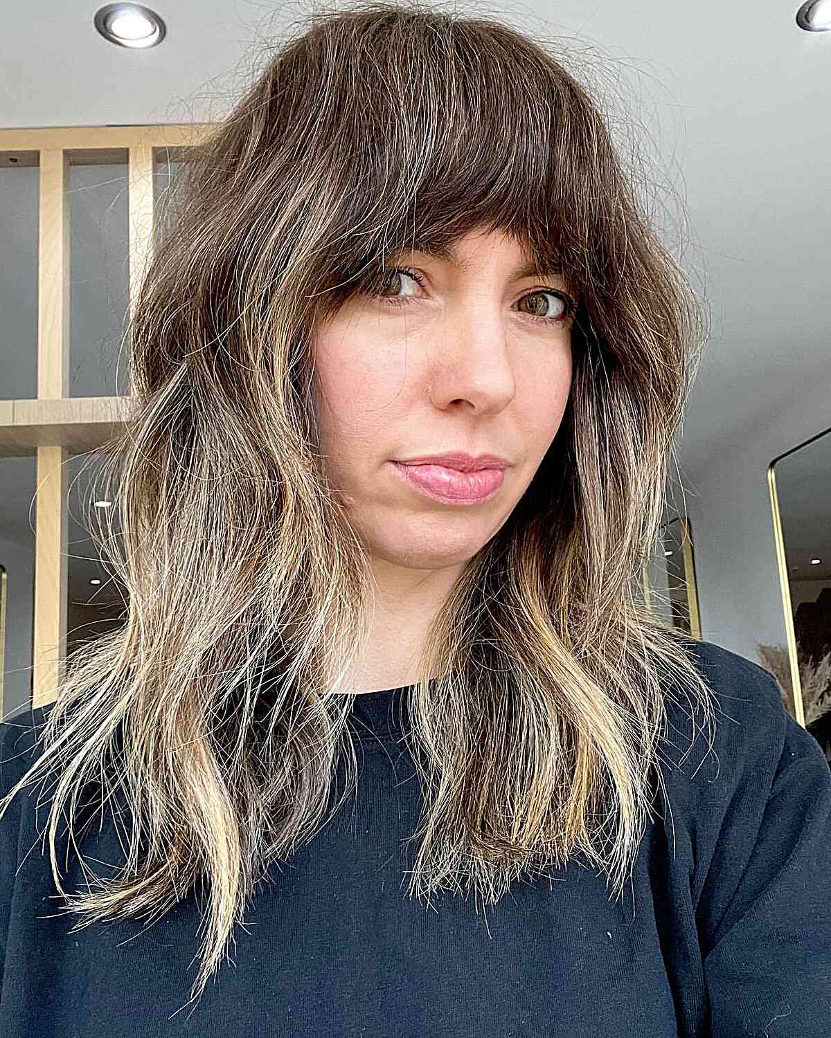 Medium Bronde Shag with Face-Framing Thick French Bangs