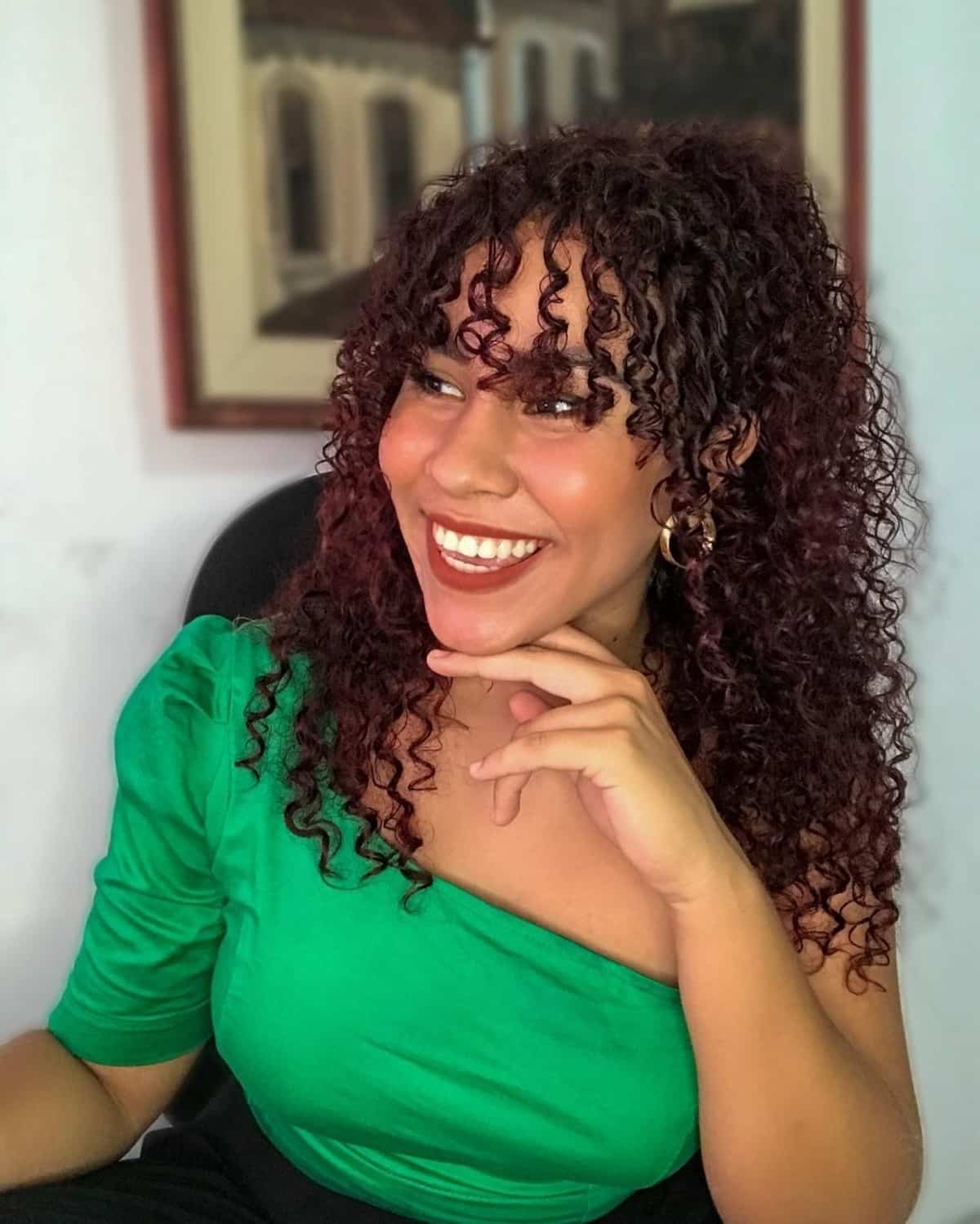 Half-up curly hair with a fringe