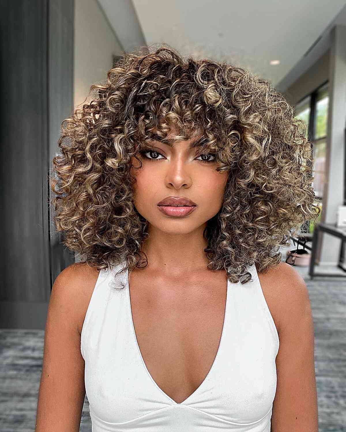 Layered Curly Long Bob with Bangs