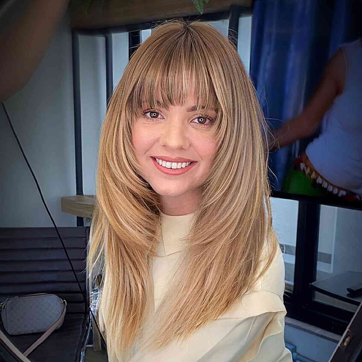 Long Blonde Visible Face-Framing Layering with Fringe