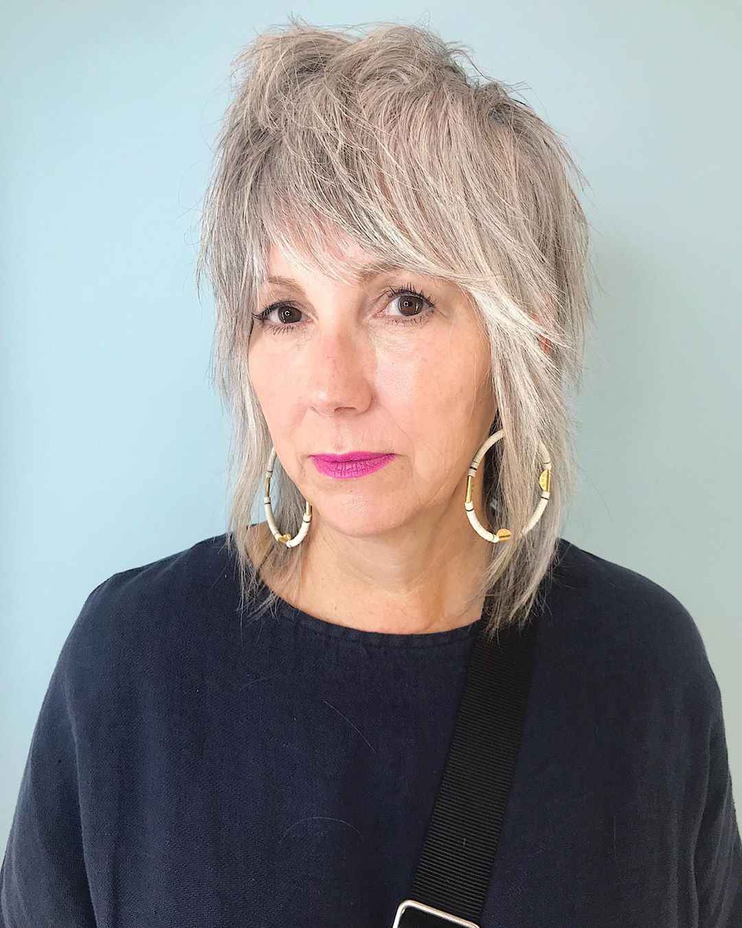 Youthful Shaggy Lob haircut for ladies over 50 with thin hair